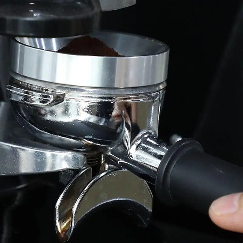 Espresso dosing ring on portafilter with fresh coffee grounds for home barista setup