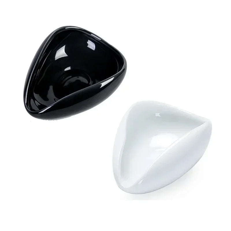 Black and white ceramic espresso dosing bowls with smooth triangular design